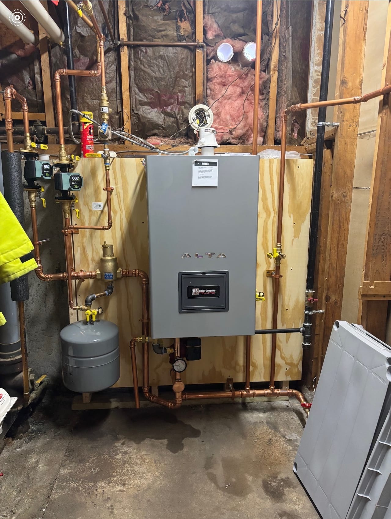 A finished condensing gas boiler installation with new copper near-boiler piping